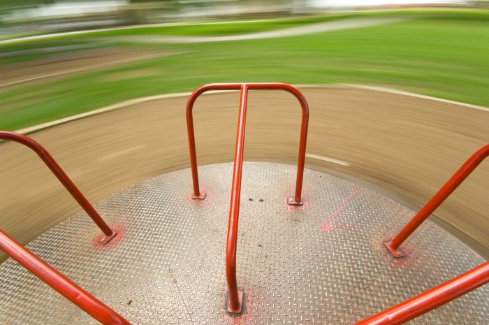 Children's Playground equipment - merry go round spinning very fast